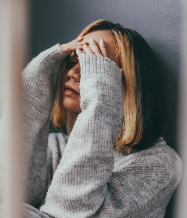 depressed-sad-young-woman-sitting-alone-home-page