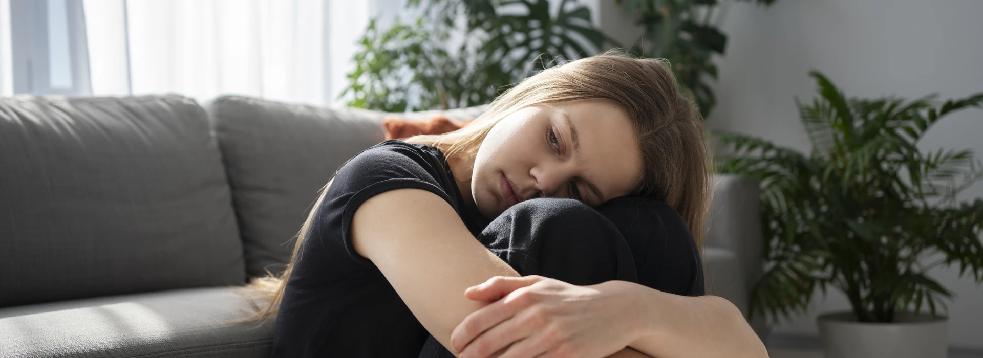 sad-young-woman-home-banner (1)