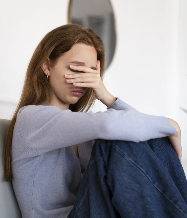 side-view-anxious-woman-sitting-couch-page